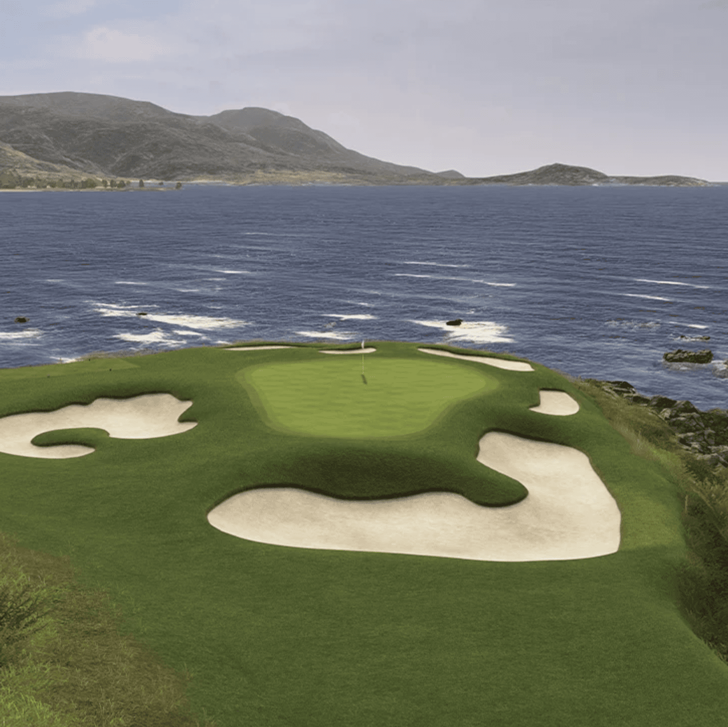 Simulator view of Pebble Beach’s seventh hole, with the green and bunkers overlooking the ocean.